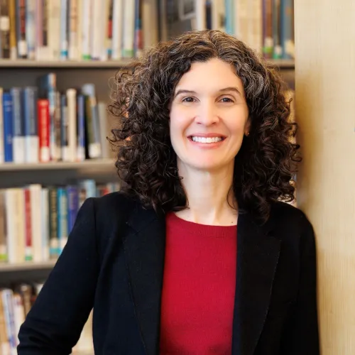 Annie Schmidt poses among the stacks at Minneapolis Central Library.