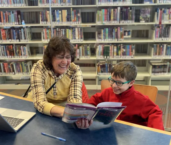 Sue and Brody read together at Brookdale Library.
