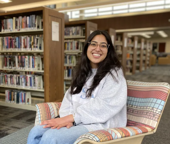 Mynah poses among the stacks at Ridgedale Library. 