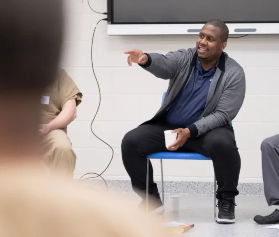 Myron Medcalf leads book discussion at Adult Correctional Facility. 