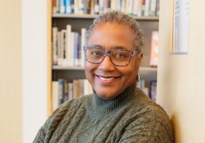 Portrait of Gale Cannon in front of the stacks at Minneapolis Central Library