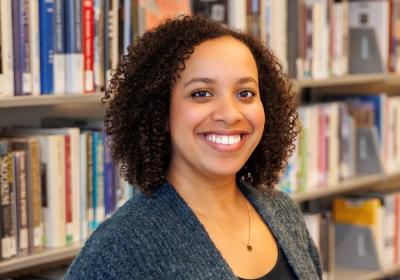 Semira Mesfin in front of stacks at Minneapolis Central Library